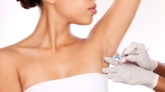 Treatment of excessive sweating (hyperhidrosis) using botulinum toxin